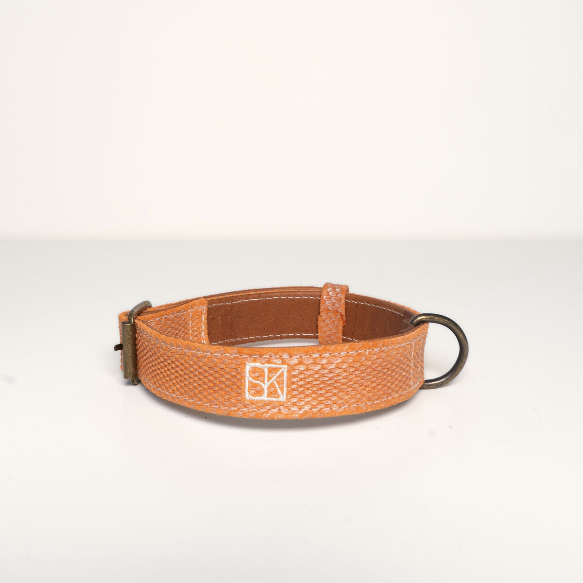 Collar Theo, orange snake embossed suede, front with SK monogram